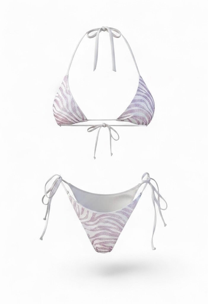 SlaySwimwear white and purple sparkle zebra print string bikini with triangle top and cheeky bottom.
