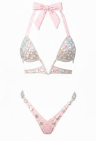 SlaySwimwear Barbie-pink rhinestone bikini set with push-up top and low-rise bottom, featuring hand-applied rhinestones and a tie-back halter.