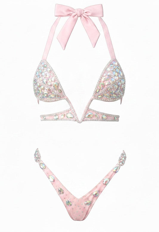 SlaySwimwear Barbie-pink rhinestone bikini set with push-up top and low-rise bottom, featuring hand-applied rhinestones and a tie-back halter.