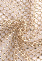 SlaySwimwear beige rhinestone mini skirt with clasp closure, above-the-knee length, and all-over sparkle.