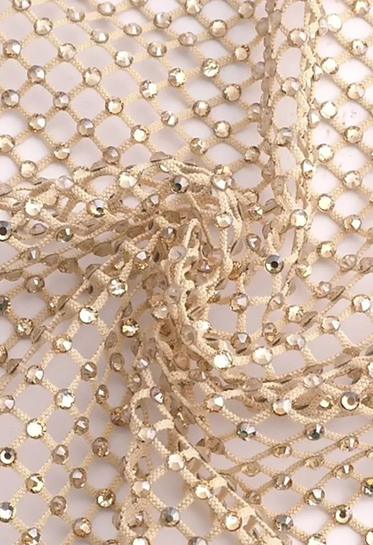 SlaySwimwear beige rhinestone mini skirt with clasp closure, featuring all-over sparkle and a lightweight feel.