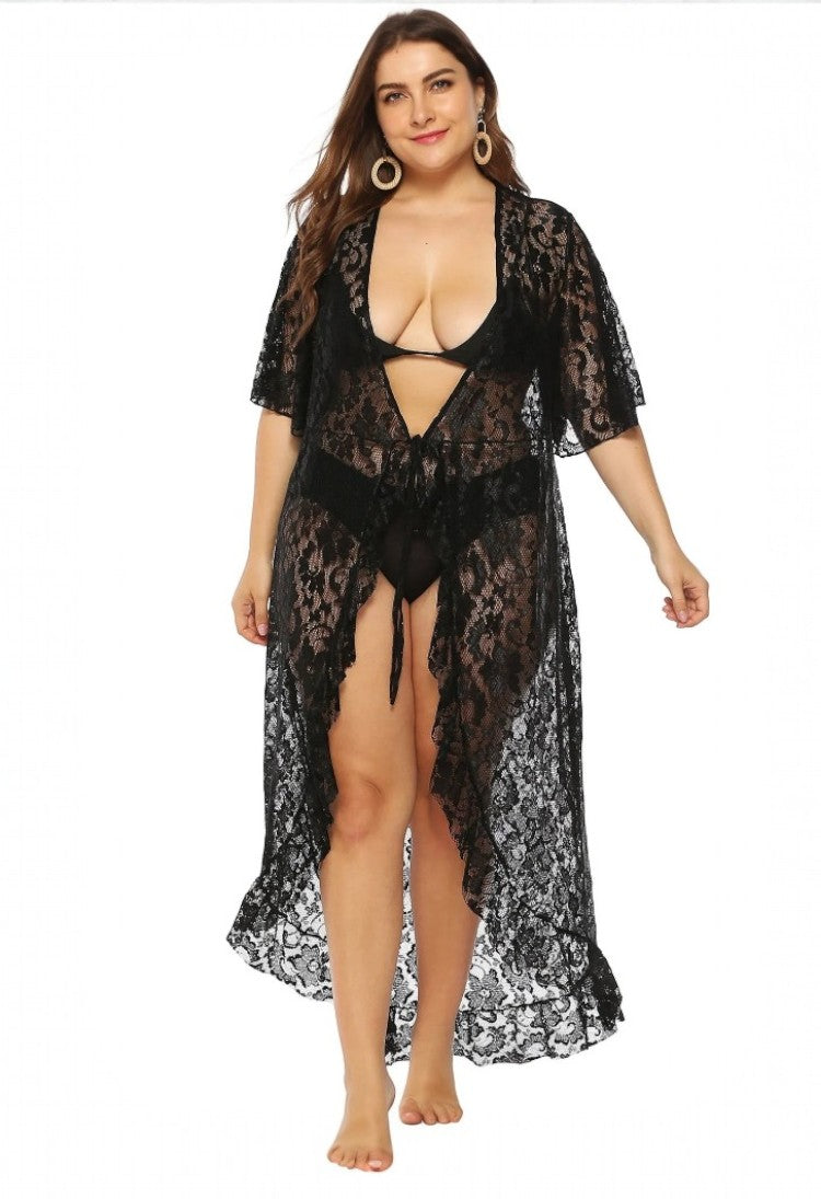 SlaySwimwear black lace kimono cover-up with tie closure and ruffled hem, worn by a plus-size model.