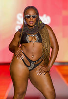 SlaySwimwear Black Beauty Luxe rhinestone bikini set with high-waist bottoms and adjustable top. Model wears a small.