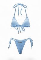 SlaySwimwear blue bikini with 3D shell print fabric, adjustable ties, and gold charm accents. Beach Babe style.