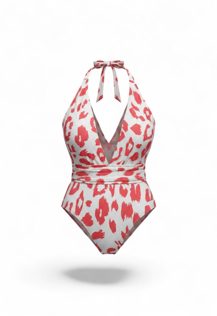 SlaySwimwear white and coral cheetah print one-piece swimsuit with plunging neckline and adjustable tie waist.