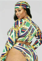 SlaySwimwear designer-inspired three-piece swimsuit for curvy women, featuring a bold chain and stripe print in green, blue, white, and red.