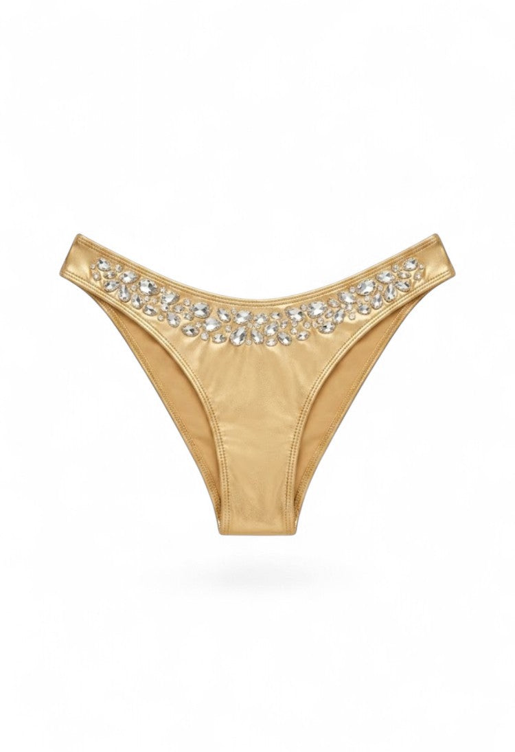 SlaySwimwear Honey Gold bikini bottoms with shimmering metallic fabric and rhinestone details on the waistband.