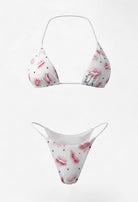 SlaySwimwear white string bikini with pink kiss print and black polka dots. Adjustable ties for custom fit.