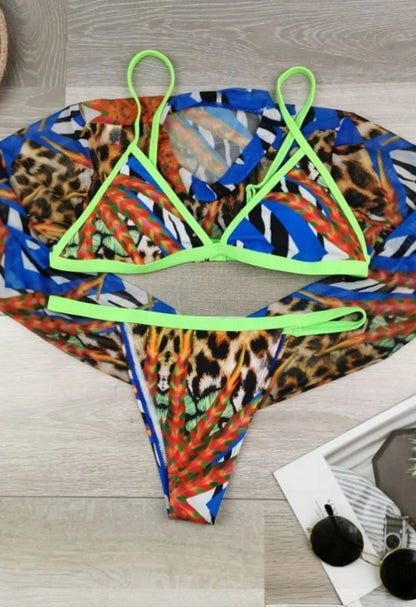 SlaySwimwear Lion Queen three-piece swimsuit set with leopard print, neon green trim, and sheer long sleeve cover-up.