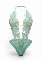 SlaySwimwear mint green jeweled one-piece swimsuit with pearl and rhinestone embellishments and adjustable neck strap.