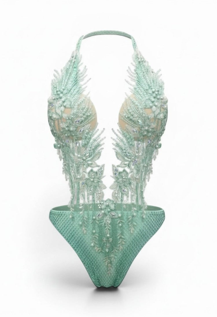 SlaySwimwear mint green jeweled one-piece swimsuit with pearl and rhinestone embellishments and adjustable neck strap.
