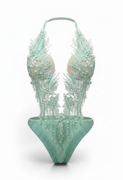 SlaySwimwear mint green jeweled one-piece swimsuit with pearl and rhinestone embellishments and adjustable neck strap.