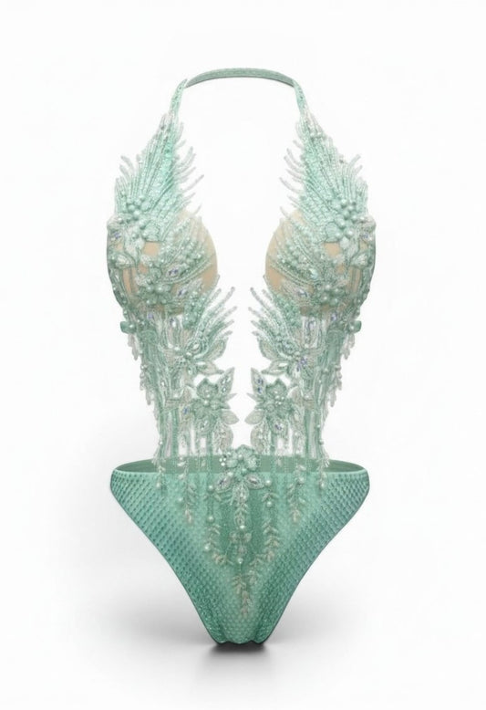 SlaySwimwear mint green jeweled one-piece swimsuit with pearl and rhinestone embellishments and adjustable neck strap.