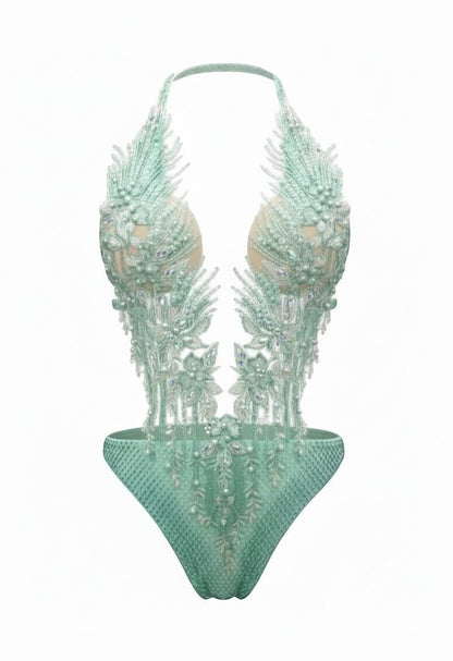 SlaySwimwear mint green jeweled one-piece swimsuit with adjustable neck strap and pearl embellishments.