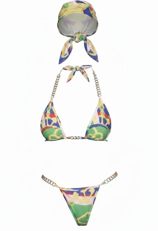 SlaySwimwear Aye Aye Captain three-piece bikini set with bandana, featuring a nautical print, gold chain accents, and a cut-out underboob top. High-leg bottom.