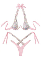 SlaySwimwear pink bikini set with sparkling rhinestones and adjustable ties. Halter top and cheeky bottoms with rhinestone accents.