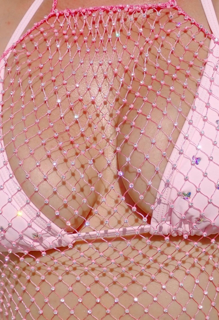 SlaySwimwear pink rhinestone encrusted fishnet halter top and matching skirt set.