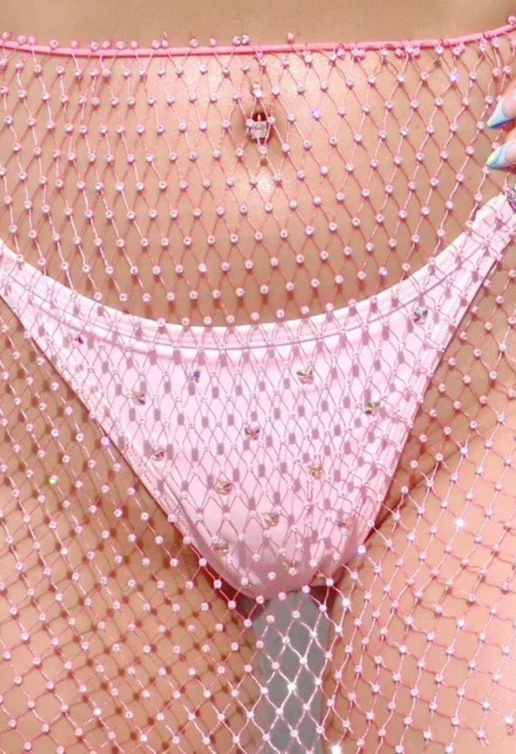 SlaySwimwear pink rhinestone-encrusted fishnet mini skirt with a stretchy waistband, perfect for festivals.
