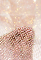SlaySwimwear pink rhinestone mini skirt with clasp closure, featuring all-over sparkle and above-the-knee length.