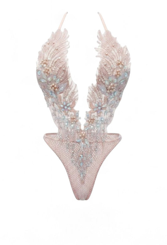 SlaySwimwear light pink one-piece swimsuit with feather-like detailing, encrusted with rhinestones, pearls, and diamonds. Adjustable neck strap.