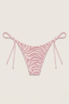 SlaySwimwear pink zebra print string bikini bottoms with shimmering accents and adjustable side ties.