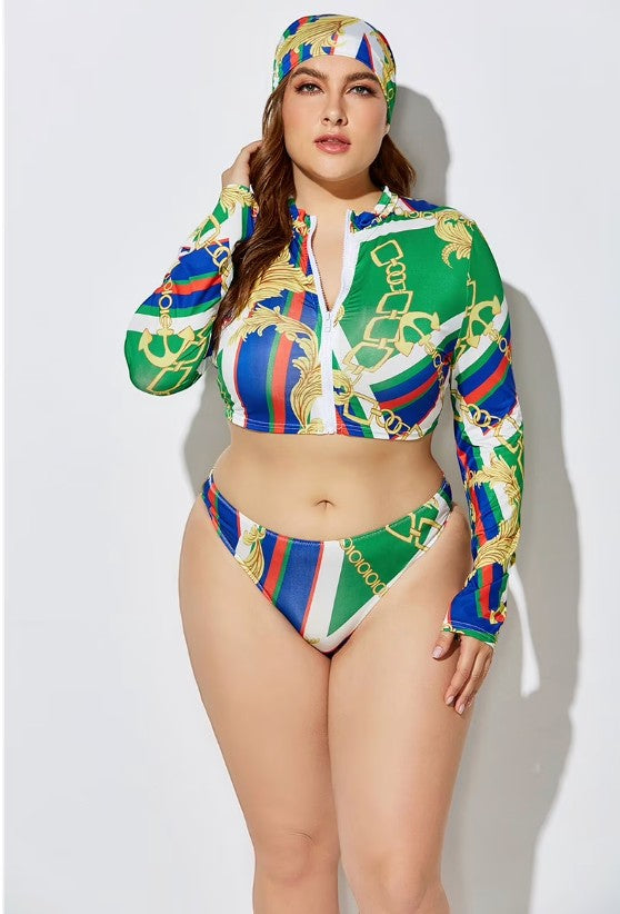 SlaySwimwear plus-size three-piece swimsuit with long-sleeve zip-up top, bikini bottoms, and matching headscarf in a green, blue, and gold chain print.