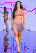 SlaySwimwear purple rhinestone mini skirt with clasp closure, above-the-knee length, perfect for parties and events.