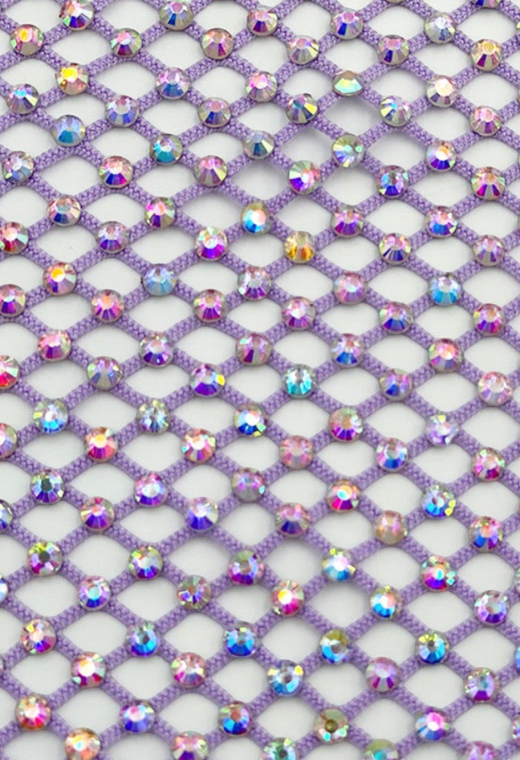 SlaySwimwear purple rhinestone mini skirt with clasp closure, featuring a fishnet design and all-over sparkle.