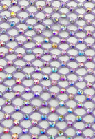 SlaySwimwear purple rhinestone mini skirt with clasp closure, above-the-knee length, and all-over sparkle.