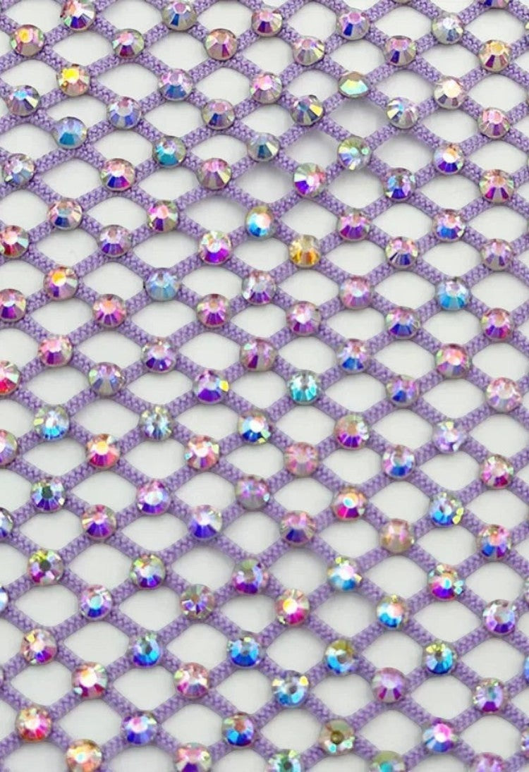 SlaySwimwear purple rhinestone mini skirt with clasp closure, above-the-knee length, and all-over sparkle.
