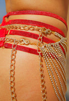 SlaySwimwear red rhinestone body chain and skirt with gold rhinestone fringe detail. Versatile piece doubles as a chest piece.