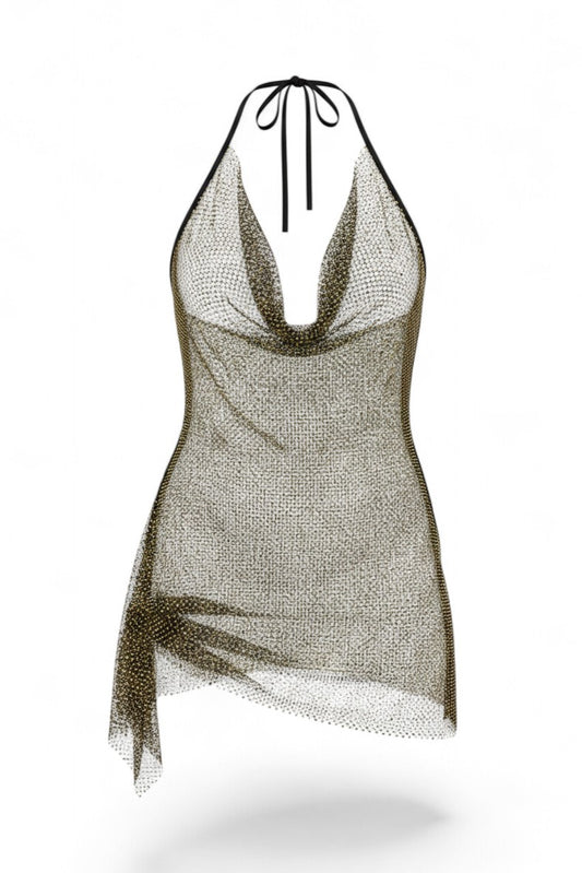 Slay Swimwear's Shine Bright Dress, a sheer rhinestone fishnet halter dress with a cowl neck, perfect as a glamorous beach cover-up.
