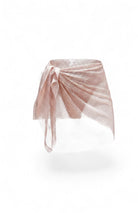 SlaySwimwear rose gold rhinestone mini skirt with feather-like embellishments and a mesh wrap tie closure.