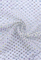 SlaySwimwear white fishnet durag encrusted with iridescent crystals, offering a glamorous and dazzling look.