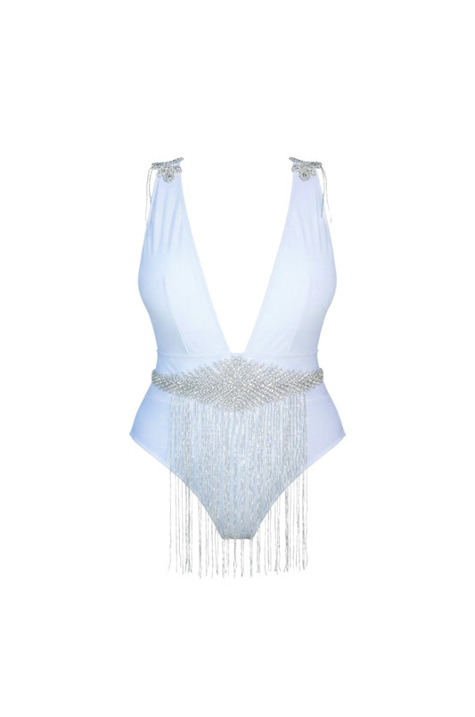 SlaySwimwear white one-piece swimsuit with plunging neckline, rhinestone embellishments on shoulders and a beaded fringe belt.