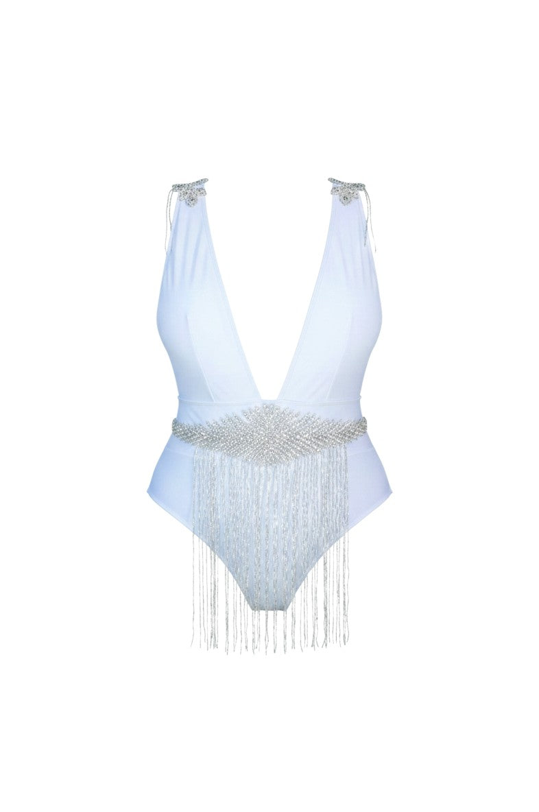 SlaySwimwear white one-piece swimsuit with plunging neckline, rhinestone embellishments on shoulders and a beaded fringe belt.