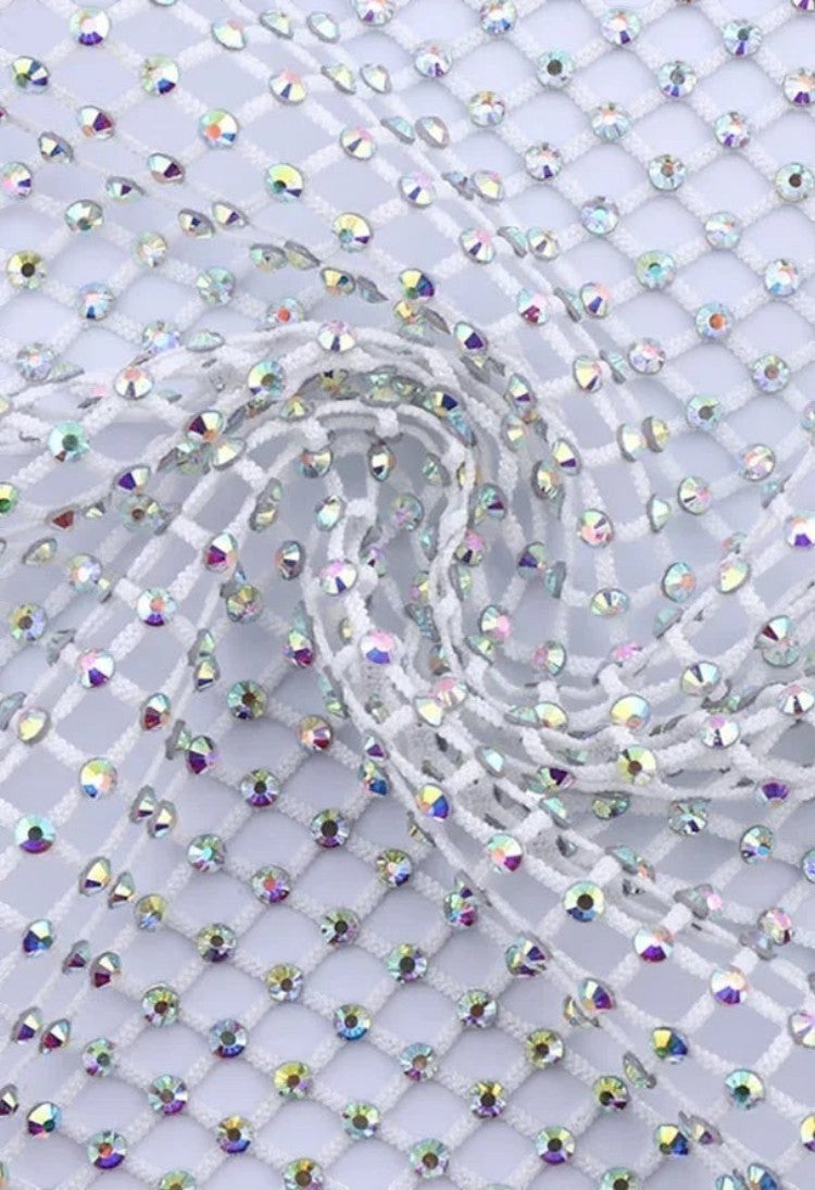 SlaySwimwear white rhinestone mini skirt with a net overlay and clasp closure, perfect for parties and events.